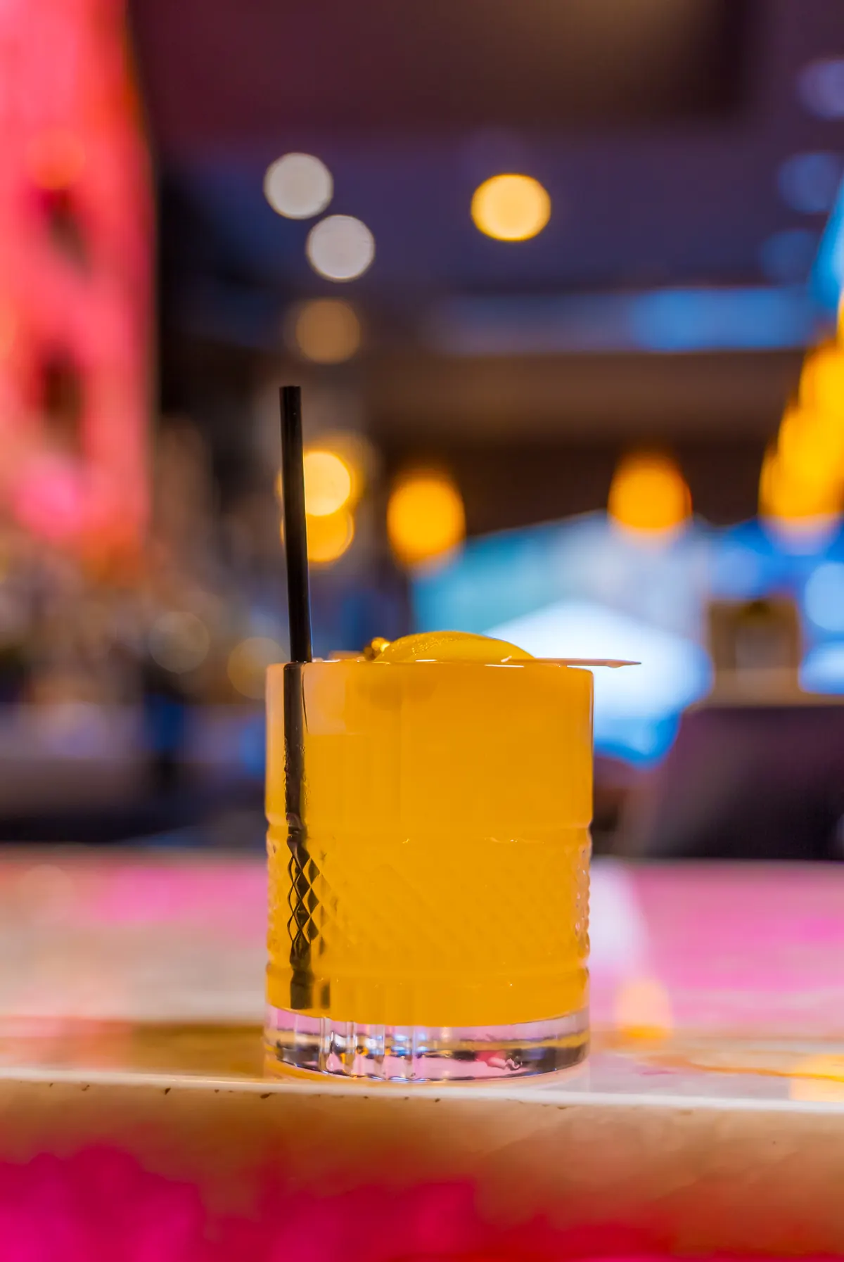 A pink cocktail at the bar